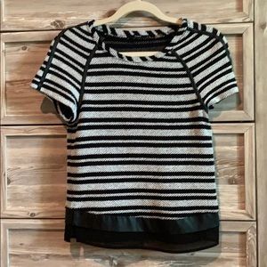 White and black woven top with leather accents